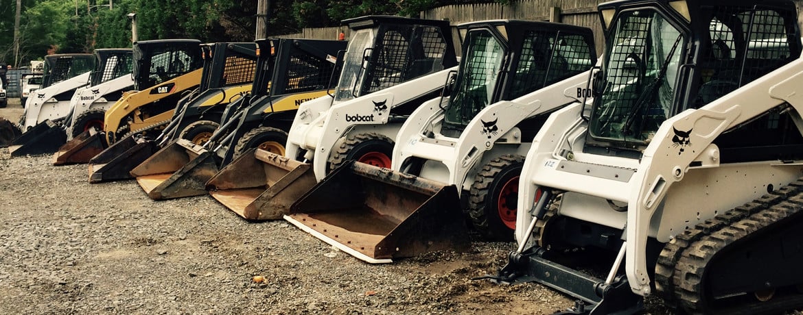 skid steers lined up